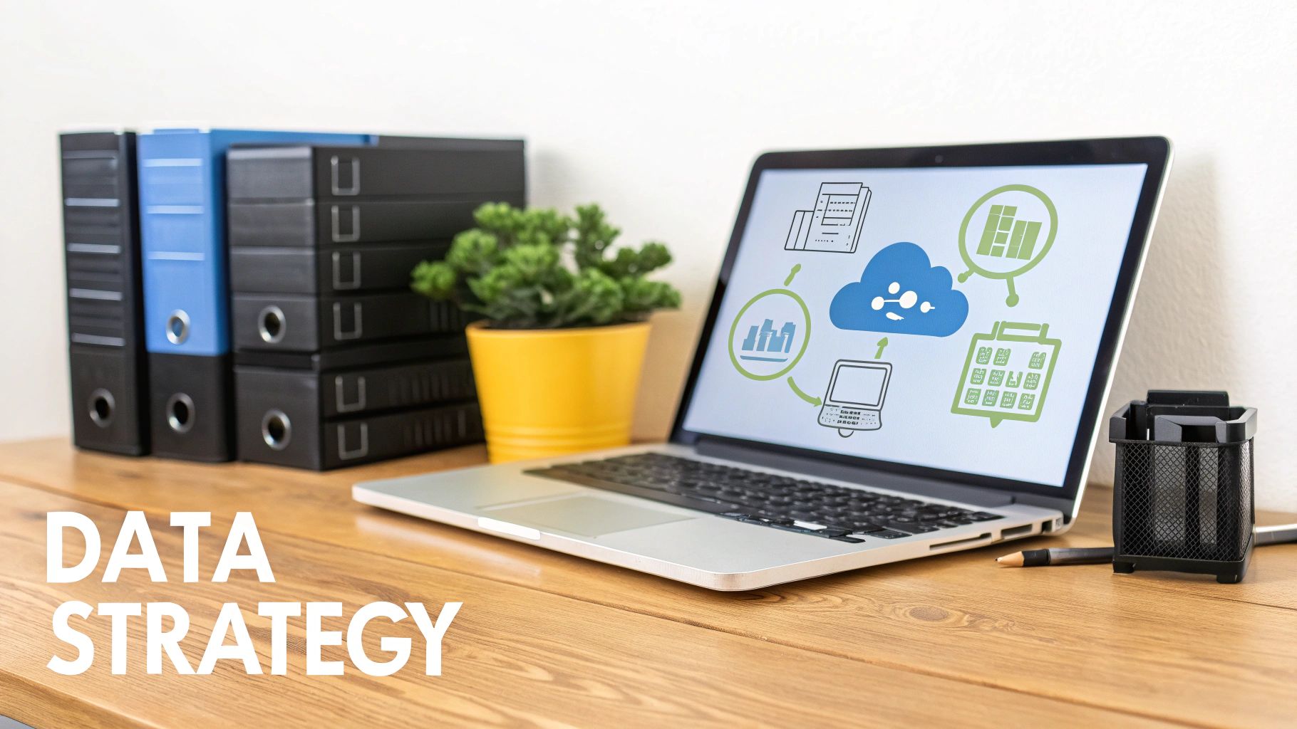 Laptop displaying data strategy cloud computing diagram with office binders and plants on wooden desk
